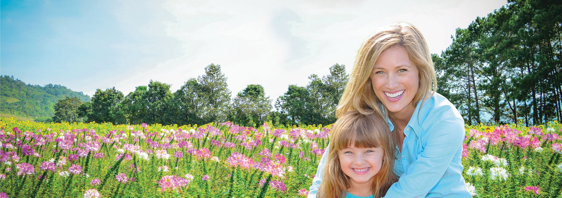 Mother and daughter in a field of flowers.